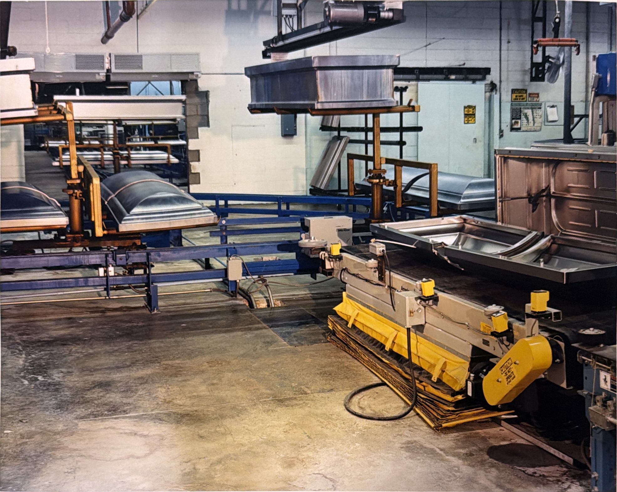 Carrier positions and production equipment at the workstation beside the inverted conveyor.