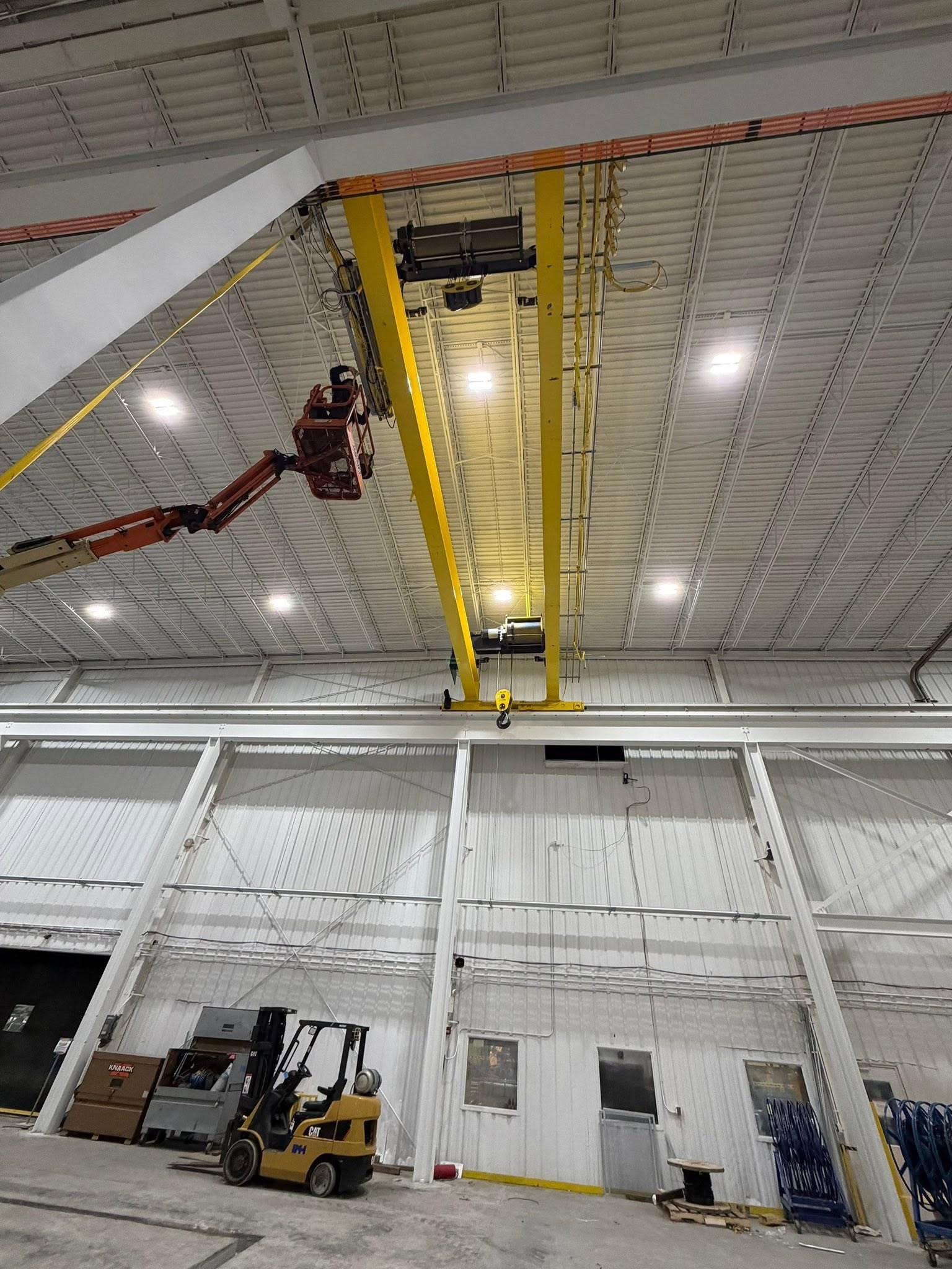 View along the replacement crane bridge toward its runway inside the enclosed bay.
