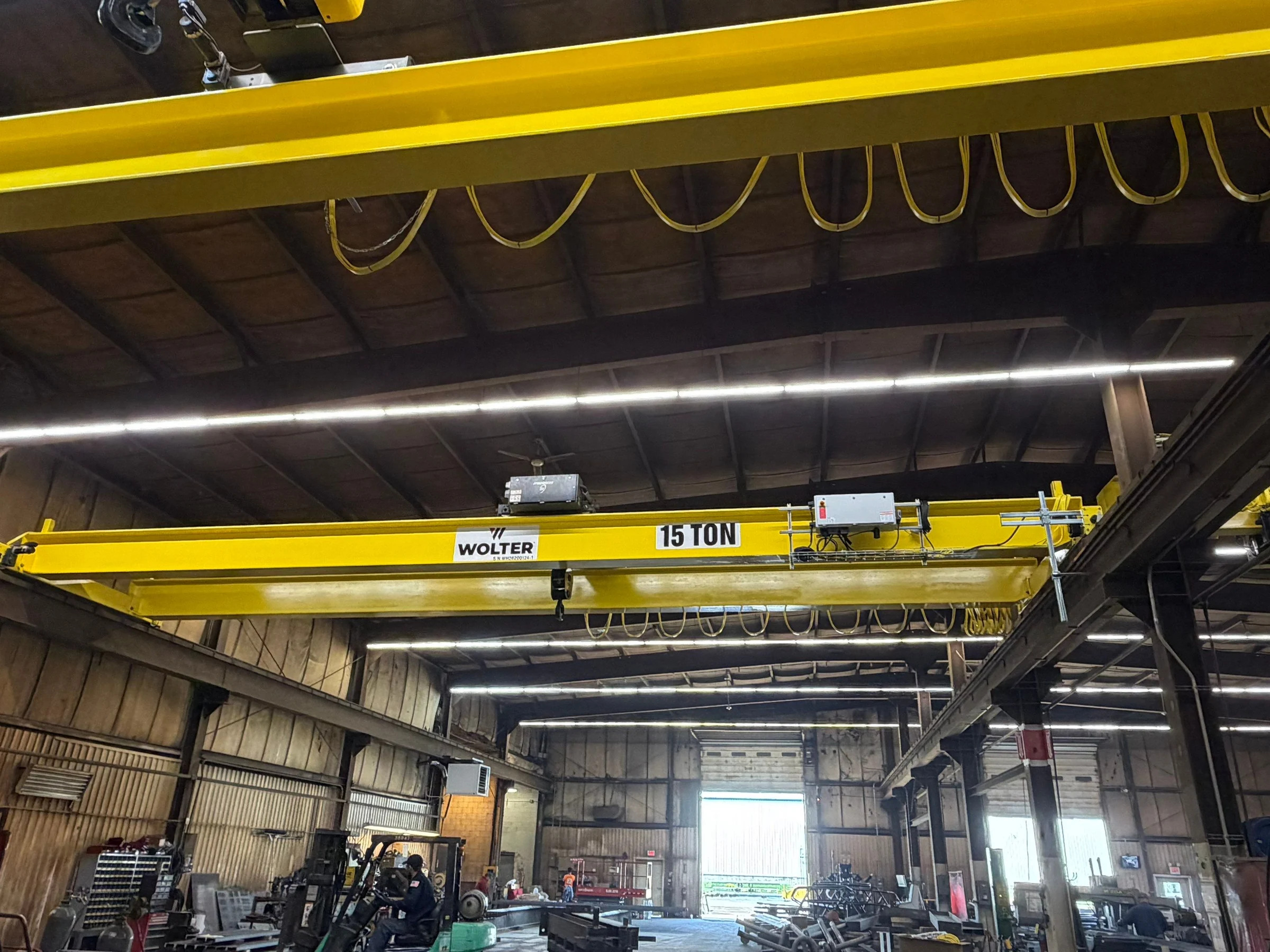 Replacement 15-ton bridge crane with festoon cables, electrical enclosure, and runway interface
