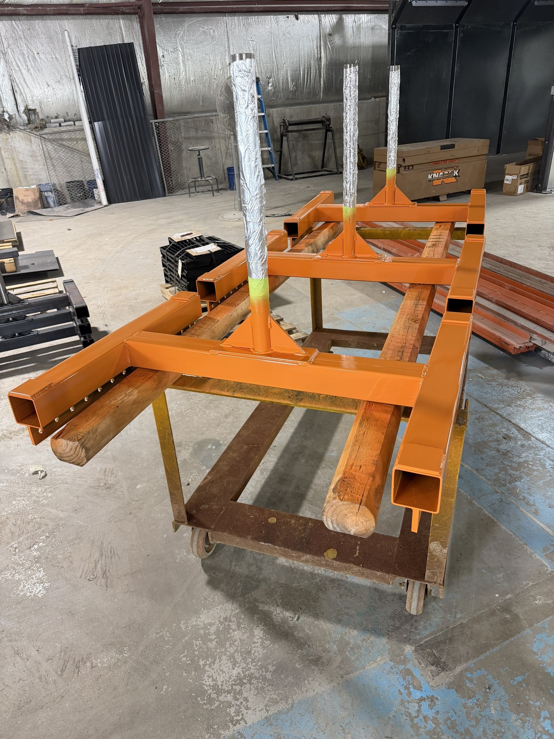 An orange carrier assembly prepared in the shop.