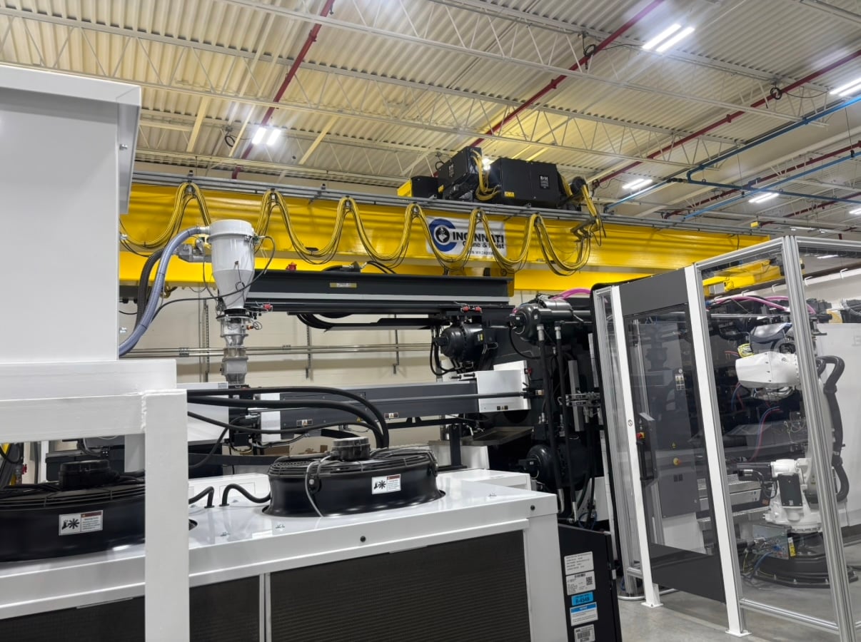 Overhead bridge crane above industrial production equipment