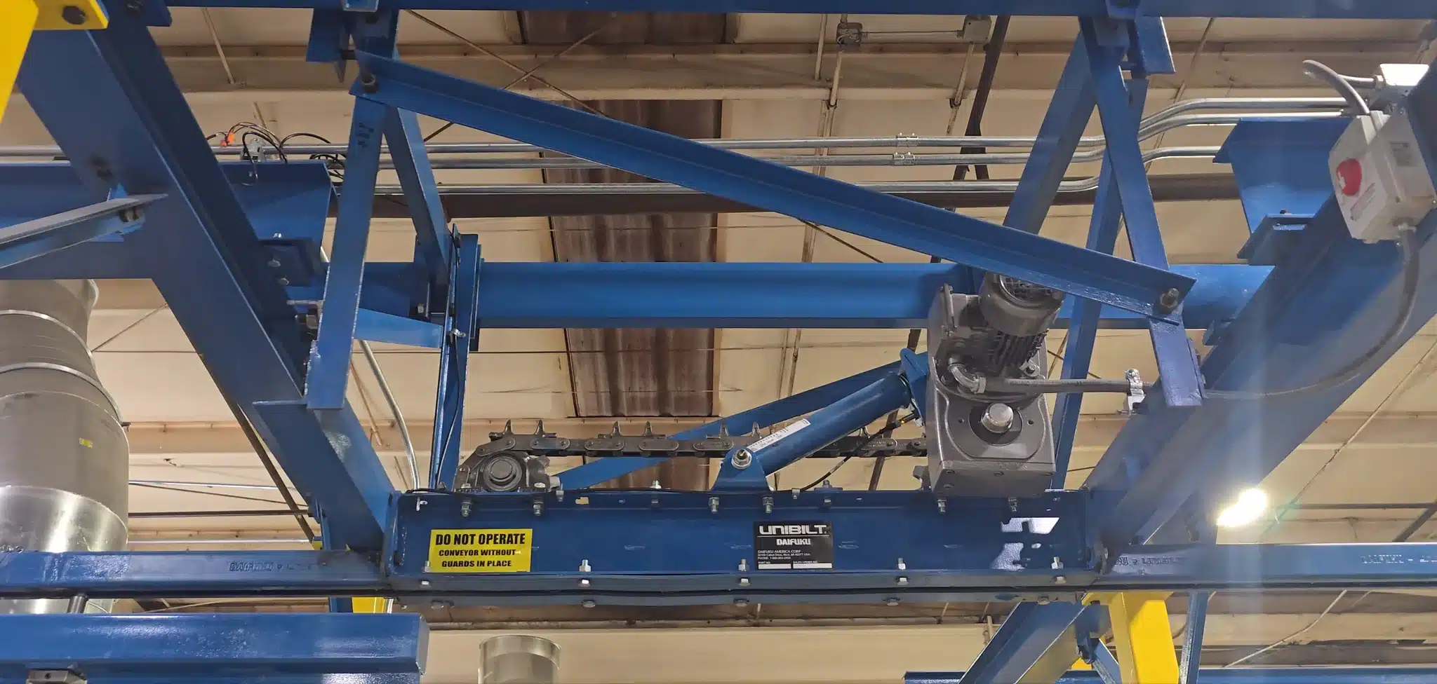 Enclosed track conveyor drive and take-up assembly with support steel