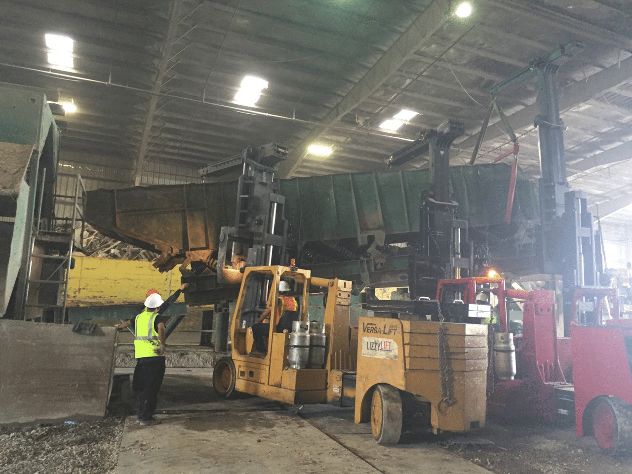 Versa-Lift machine moving equipment in an active industrial facility