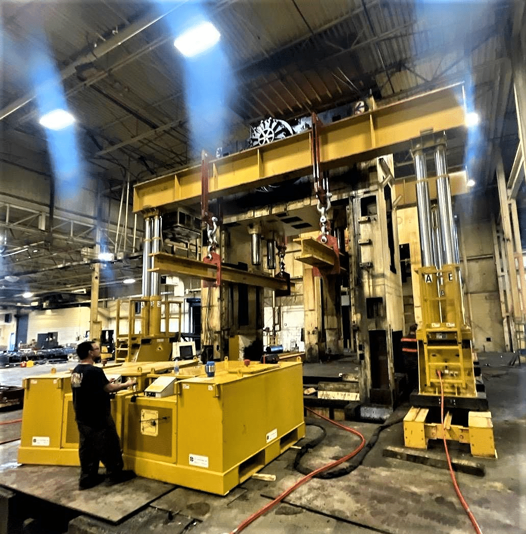 Industrial rigging equipment and yellow lifting machinery prepared for relocation
